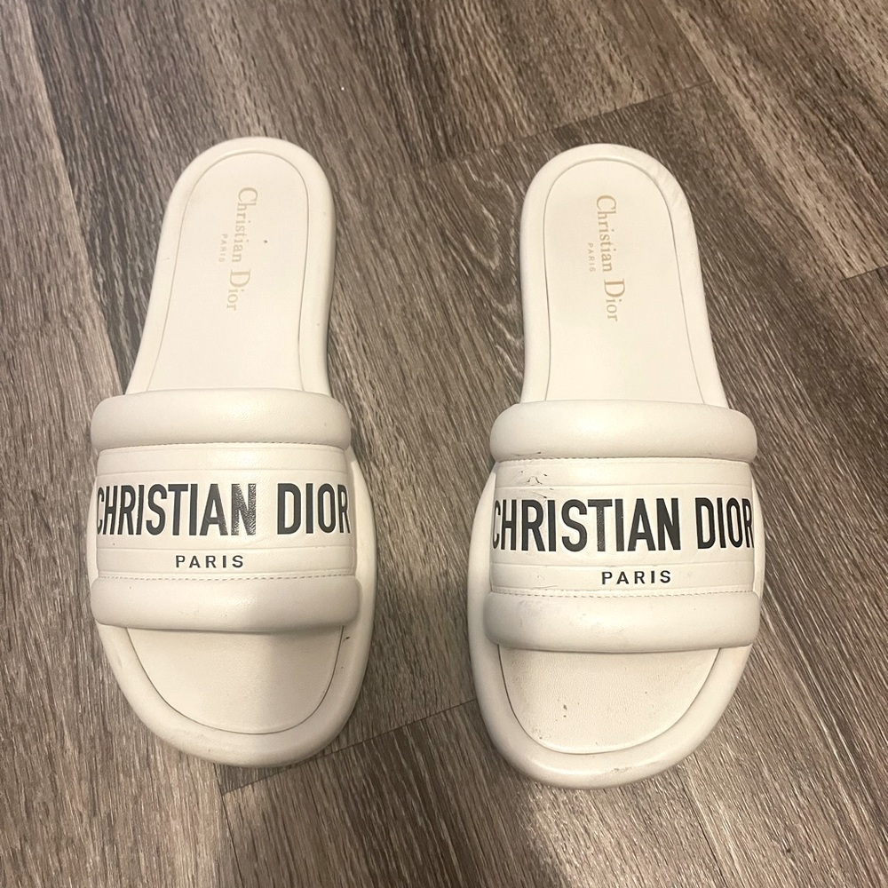 White Christian Dior flats with black writing